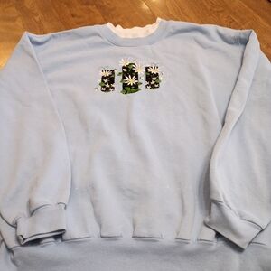 Women's Light Blue Sweatshirt with Floral Design